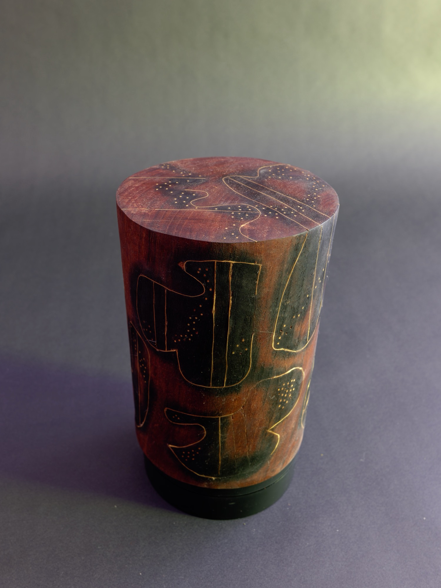Dream — three-quarter view showing inscribed figures wrapping the cylinder’s shoulder.